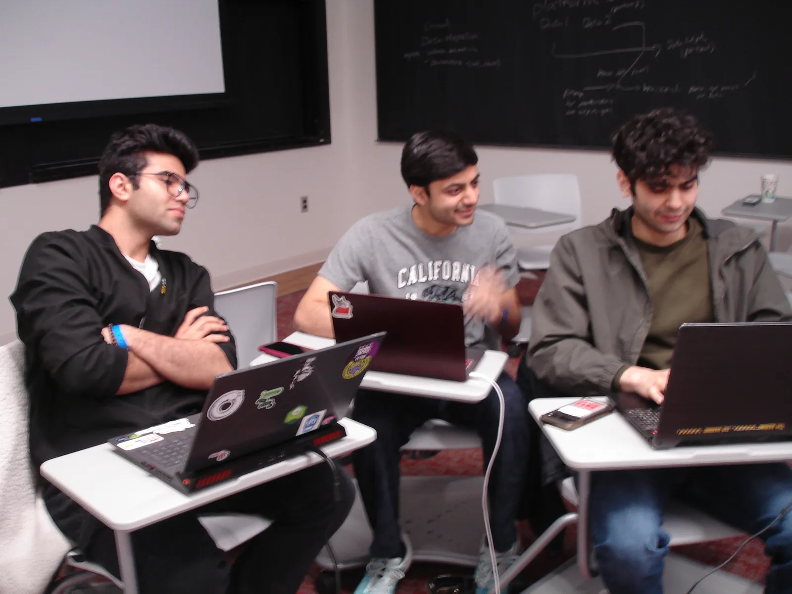The HiveOps team building through the night at YHack.