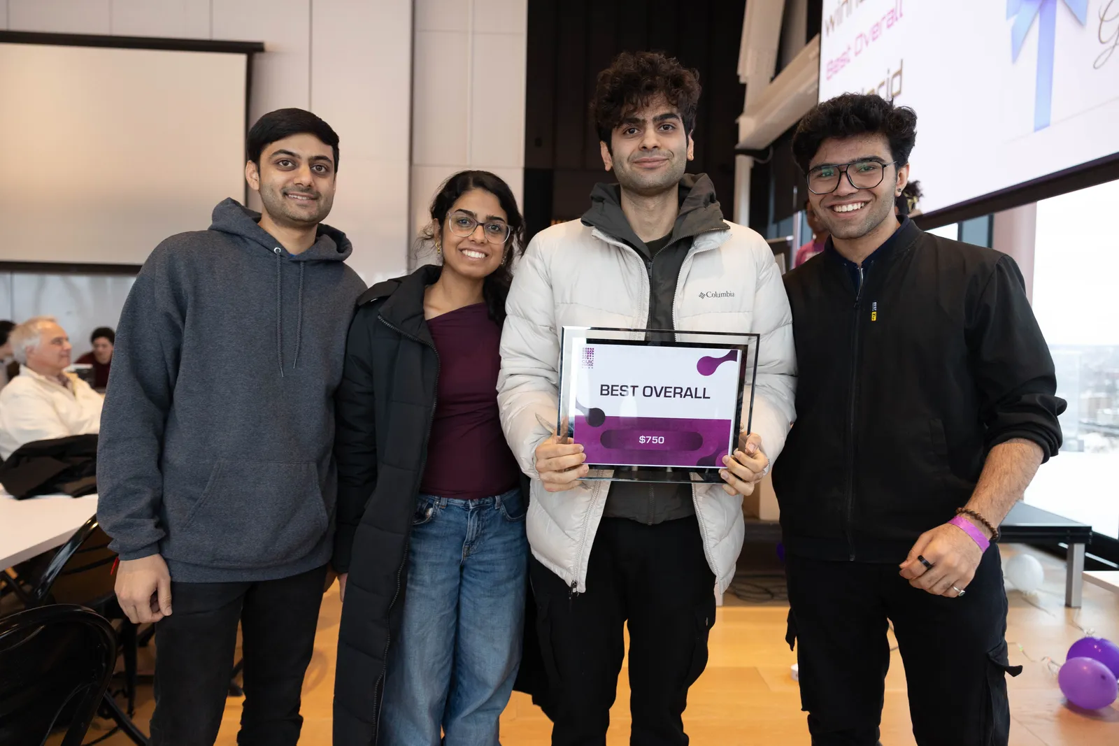 The FoodGrid team holding the Best Overall award at MLH CivicHacks.